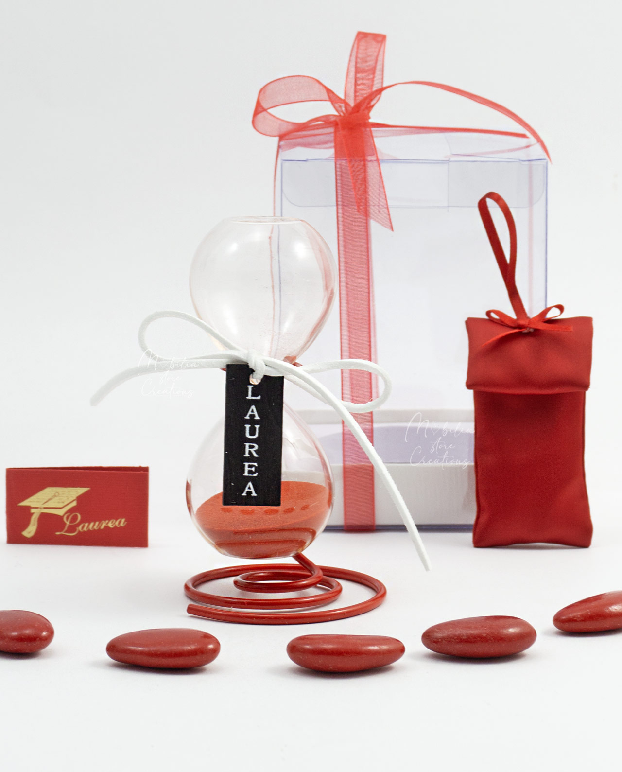 Bomboniera Clessidra con sabbia rossa e stand assortita
