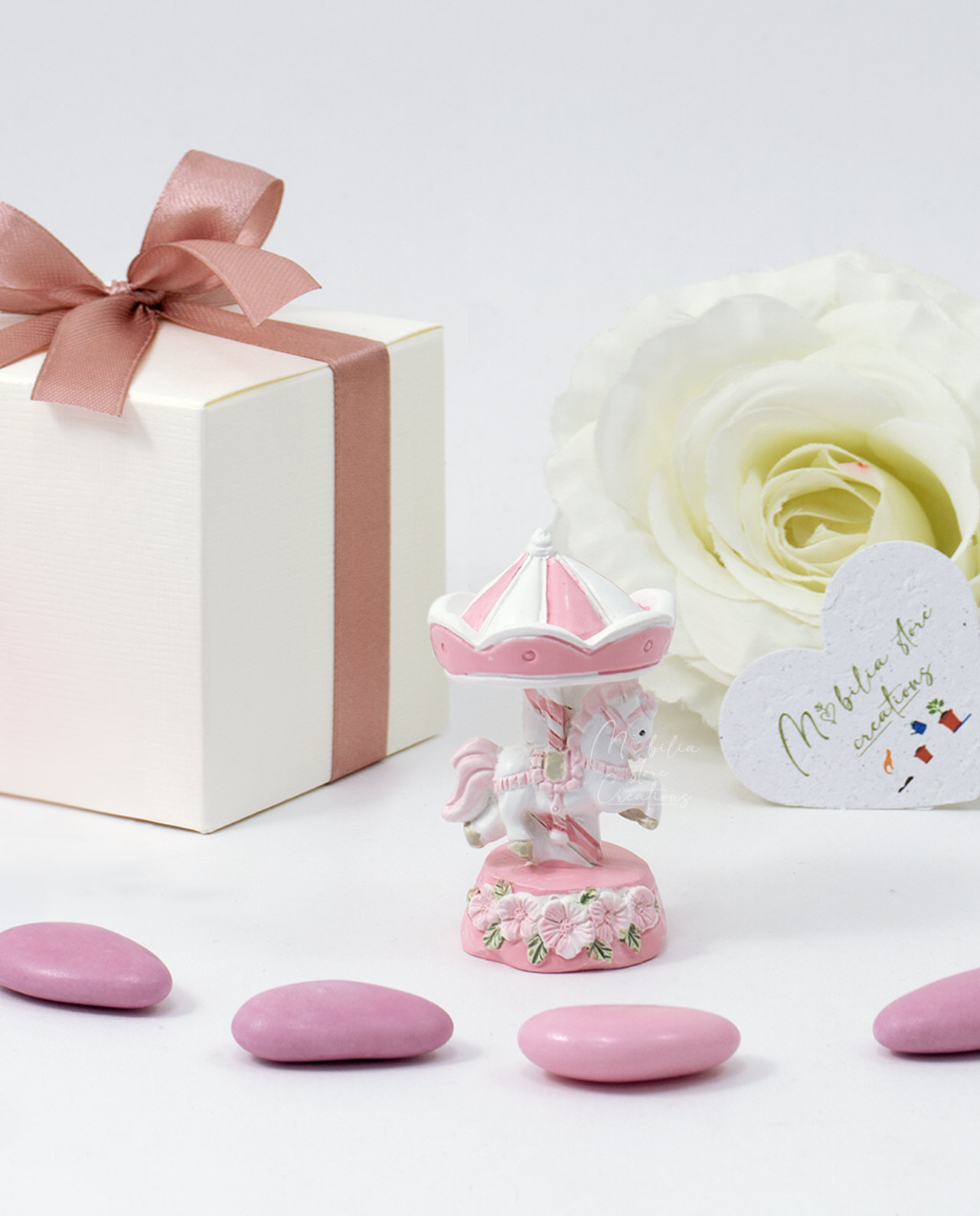 Bomboniera giostrina con cavallo rosa e fiori