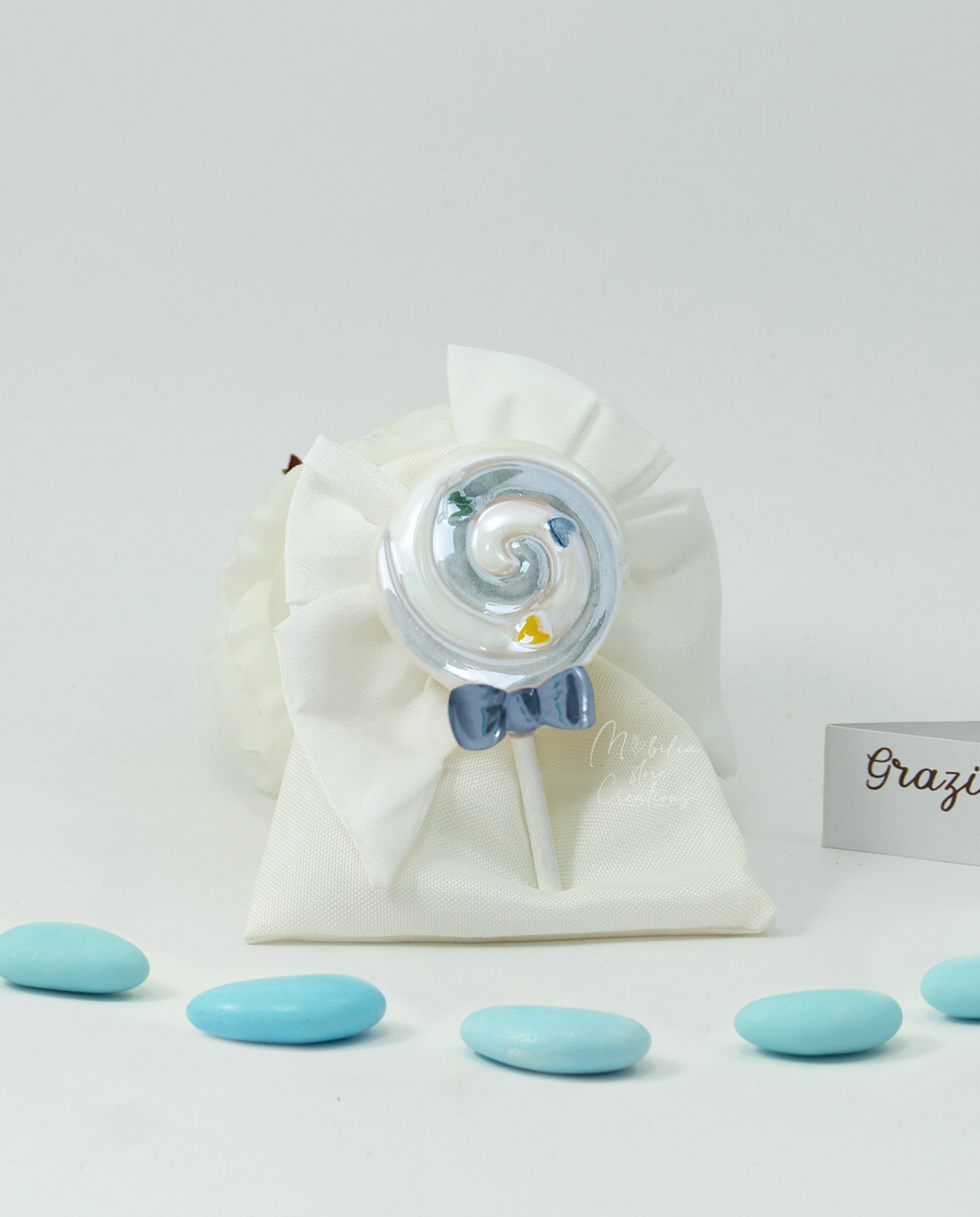 Bomboniera magnete lollipop azzurro su sacchetto